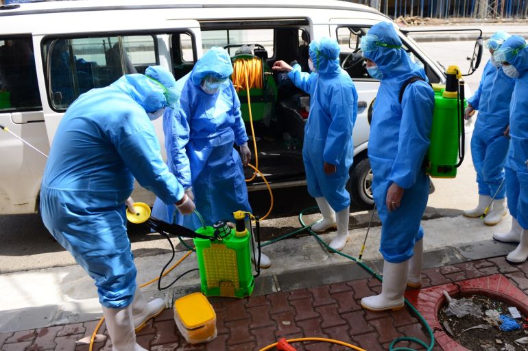 Coronavirus precautions in Iraq's Sulaymaniyah- - SULAYMANIYAH, IRAQ - MARCH 23: Teams affiliated to the Provincial Directorate of Health wearing protective suits, disinfect public places as part of precautions against the coronavirus (COVID-19), in Sulaymaniyah, Iraq on March 23, 2020.
