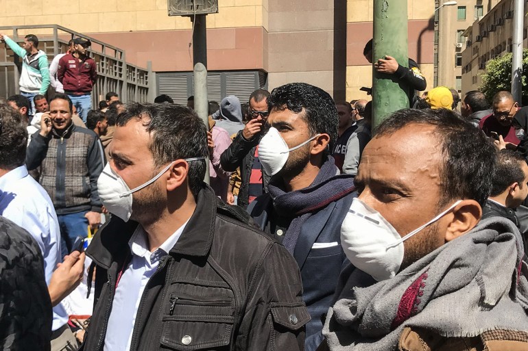 People wearing a protective mask in Cairo, Egypt, on March 8, 2020. Egyptians who wants to travel gathering front of egyptian health ministry to do corona-virus analysis before travel as a condition to enter the other countries. (Photo by Islam Safwat/NurPhoto via Getty Images)