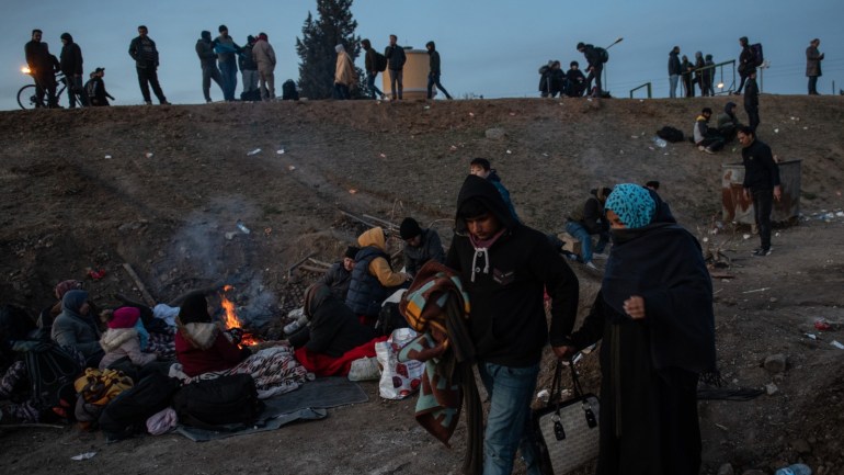 EDIRNE, TURKEY - MARCH 01: Refugees and migrants warm themselves near a fire as they attempt to enter Greece from Turkey on March 01, 2020 in Edirne, Turkey. Refugees and migrants from various countries board a boat in an attempt to reach Greece from Turkey by crossing the Evros River on March 01, 2020 in Edirne, Turkey. Thousands of refugees and migrants have flocked to the Greece, Turkey border after Turkey announced that it would open border gates for a period of 72hrs to allow refugees to cross into European countries after thirty three Turkish soldiers were killed in a Syrian air raid in Idlib. (Photo by Burak Kara/Getty Images)