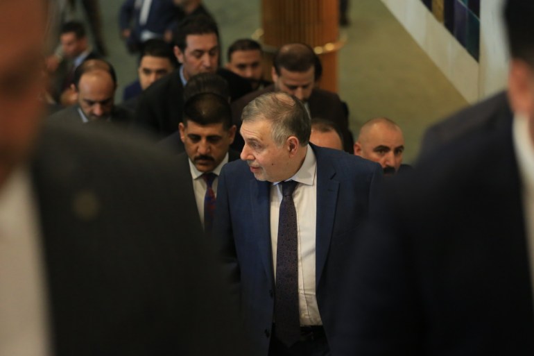 Vote of confidence session in Iraqi parliament- - BAGHDAD, IRAQ - MARCH 1: Prime Minister-designate Mohammed Tawfiq Allawi (C) tasked to form the new government arrives at the Iraqi parliament building to attend a session for vote of confidence in Baghdad, Iraq on March 1, 2020.