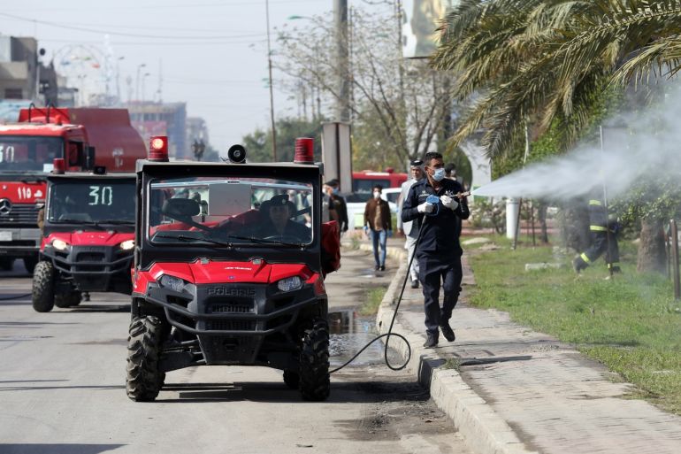 Coronavirus precautions in Iraq- - BAGHDAD, IRAQ - MARCH 23: Officials carry out disinfection works at the streets as part of precautions against the coronavirus (COVID-19), at Sadr district of Baghdad, Iraq on March 23, 2020.