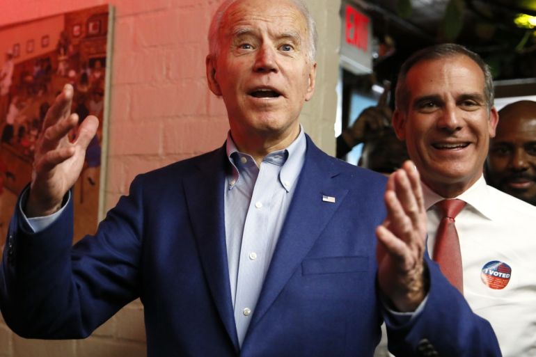 U.S. Democratic presidential candidate and former Vice President Joe Biden arrives with Los Angeles Mayor Eric Garcetti at Roscoe's Chicken and Waffles as he campaigns before his evening rally on Super Tuesday in Los Angeles, California, U.S., March 3, 2020. REUTERS/Elizabeth Frantz