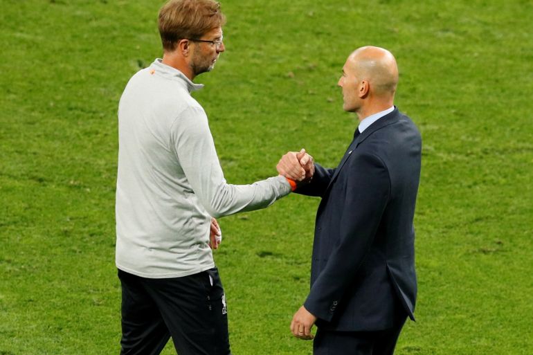 Soccer Football - Champions League Final - Real Madrid v Liverpool - NSC Olympic Stadium, Kiev, Ukraine - May 26, 2018 Real Madrid coach Zinedine Zidane shakes hands with Liverpool manager Juergen Klopp at the end of the match REUTERS/Phil Noble