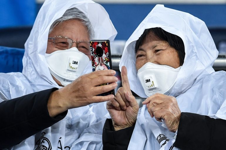 MADRID, SPAIN - MARCH 01: Fans wear 3M Aura Disposable Respirators as they await kickoff prior to the during the Liga match between Real Madrid CF and FC Barcelona at Estadio Santiago Bernabeu on March 01, 2020 in Madrid, Spain. (Photo by David Ramos/Getty Images)