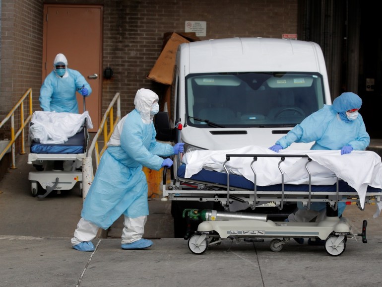 Healthcare workers wheel the bodies of deceased people from the Wyckoff Heights Medical Center during the outbreak of the coronavirus disease (COVID-19) in the Brooklyn borough of New York City, New York, U.S., April 2, 2020. REUTERS/Brendan Mcdermid TPX IMAGES OF THE DAY