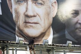 TEL AVIV, ISRAEL - FEBRUARY 17: Workers hang a Blue and White Party billaboard showing its leader Benny Gantz and Israeli Prime Minister, Benjamin Netanyahu, as part of the party's campaign on February 17, 2020 in Tel Aviv, Israel. In two weeks Israelis will head to the polls for the third election in less than a year. (Photo by Amir Levy/Getty Images)