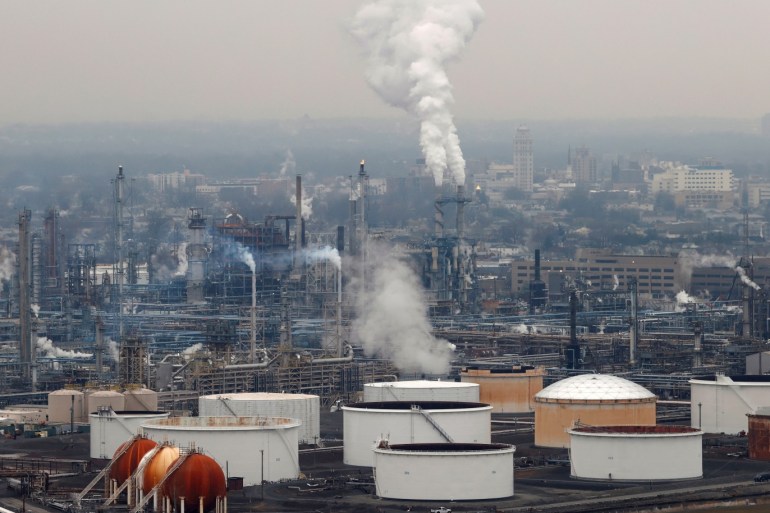 General view of oil tanks and the Bayway Refinery of Phillips 66 in Linden, New Jersey, U.S., March 30, 2020. REUTERS/Mike Segar REFILE - CORRECTING REFINERY NAME