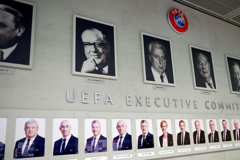Portraits of the members of the Executive Board of the UEFA are pictured on a wall in Nyon, Switzerland, February 28, 2020. Picture taken February 28, 2020. REUTERS/Denis Balibouse