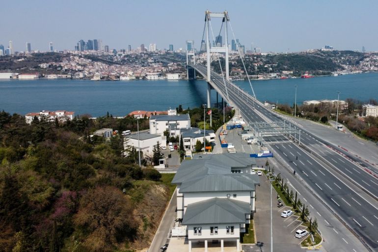 An aerial view of a deserted street leads to July 15 Martyrs' Bridge, known as the Bosphorus Bridge, during a two-day curfew which was imposed to prevent the spread of the coronavirus disease (COVID-19), in Istanbul, Turkey, April 11, 2020. Picture taken with a drone. REUTERS//Umit Bektas