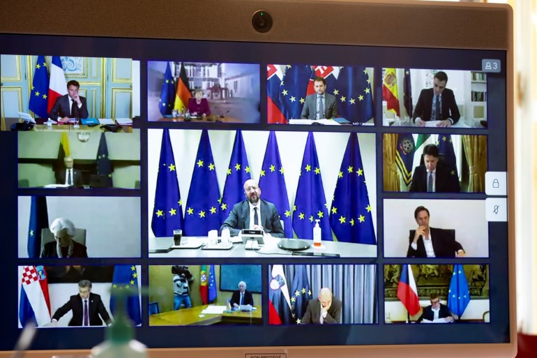 Members of the European Council are seen on a screen during a video conference with French President Emmanuel Macron (unseen), amid the outbreak of COVID-19 disease, at the Elysee Palace in Paris, France April 23, 2020. Ian Langsdon/Pool via REUTERS