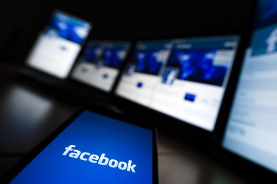 The loading screen of the Facebook application on a mobile phone is seen in this photo illustration taken in Lavigny May 16, 2012. Facebook Inc increased the size of its initial public offering by almost 25 percent, and could raise as much as $16 billion as strong investor demand for a share of the No.1 social network trumps debate about its long-term potential to make money. Facebook, founded eight years ago by Mark Zuckerberg in a Harvard dorm room, said on Wednesday it will add about 84 million shares to its IPO, floating about 421 million shares in an offering expected to be priced on Thursday. REUTERS/Valentin Flauraud (SWITZERLAND - Tags: BUSINESS SCIENCE TECHNOLOGY SOCIETY)