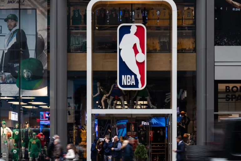 NEW YORK, NY - MARCH 12: An NBA logo is shown at the 5th Avenue NBA store on March 12, 2020 in New York City. The National Basketball Association said they would suspend all games after player Rudy Gobert of the Utah Jazz reportedly tested positive for the coronavirus. Jeenah Moon/Getty Images/AFP== FOR NEWSPAPERS, INTERNET, TELCOS & TELEVISION USE ONLY ==