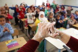 Syrian refugee students take part in a washing hands activity during an awareness campaign about coronavirus initiated by OXFAM and UNICEF at Zaatari refugee camp in the Jordanian city of Mafraq, near the border with Syria, March 11, 2020. REUTERS/ Muhammad Hamed