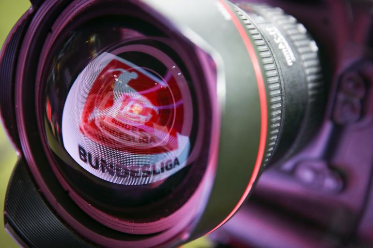 FRANKFURT AM MAIN, GERMANY - DECEMBER 16: (EDITORS NOTE: Image has been reversed) A LED board showing the Bundesliga logo is reflected in a lens prior to the Bundesliga match between Eintracht Frankfurt and Bayer 04 Leverkusen at Commerzbank-Arena on December 16, 2018 in Frankfurt am Main, Germany. (Photo by Alex Grimm/Bongarts/Getty Images)