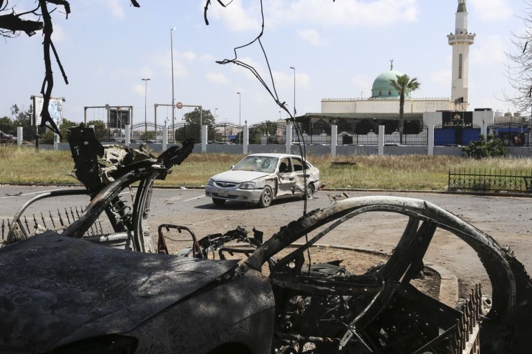 Warlord Khalifa Haftar’s forces target hospital for COVID-19 treatment- - TRIPOLI, LIBYA - APRIL 07: A vehicle is wrecked and another damaged after warlord Khalifa Haftar’s forces targeted Khadra hospital assigned for coronavirus (COVID-19) treatment in Tripoli, Libya on April 07, 2020.
