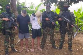 2 "mercenaries" caught on charges of coup in Venezuela - - PUERTO CRUZ, VENEZUELA - MAY 8: (----EDITORIAL USE ONLY – MANDATORY CREDIT - " DEFENSE MINISTRY OF VENEZUELA/ HANDOUT" - NO MARKETING NO ADVERTISING CAMPAIGNS - DISTRIBUTED AS A SERVICE TO CLIENTS----) A photo shows 2 "mercenaries" caught by Venezuelan soldiers on charges of coup in Puerto Cruz, Venezuela on May 8, 2020.