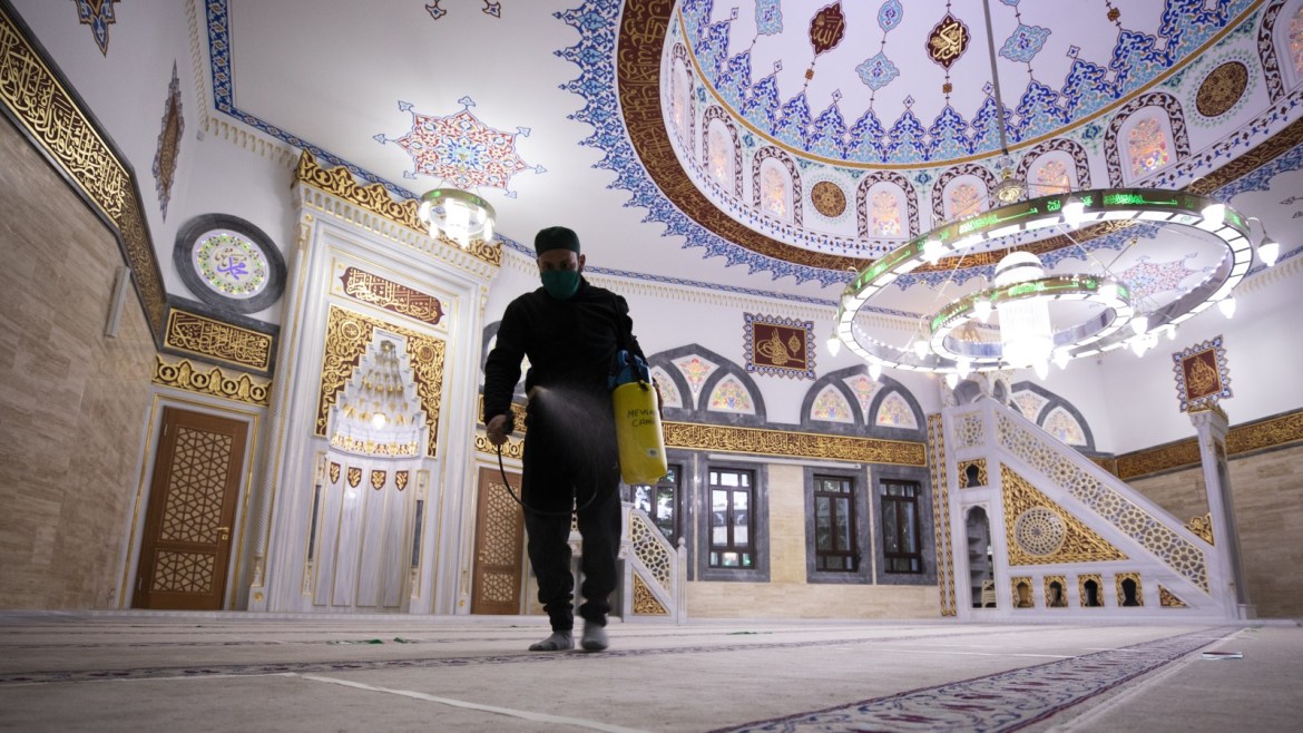 Germany: Muslims go back to mosques- - BERLIN, GERMANY - MAY 9: An official disinfect inside of mosque after performing prayer at Mevlana Mosque with social distancing after mosques in Germany reopen their doors to worshippers, following a government decision to ease coronavirus restrictions in the country in Berlin, Germany on May 9, 2020.