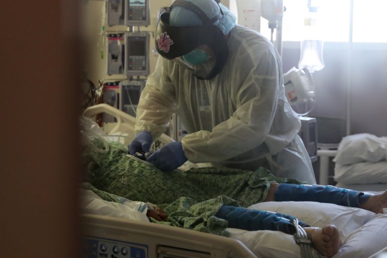 A patient suffering from the coronavirus disease (COVID-19) is treated in the Intensive Care Unit (ICU), at Scripps Mercy Hospital in Chula Vista, California, U.S., May 12, 2020. REUTERS/Lucy Nicholson