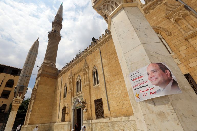 Election poster of Egypt's former army chief Abdel Fattah al-Sisi is seen on a column at Al-Hussein mosque in the old Islamic area of Cairo