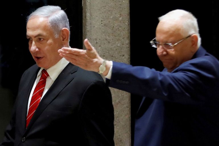 Israeli President Reuven Rivlin and Prime Minister Benjamin Netanyahu arrive to a nomination ceremony at the President's residency in Jerusalem September 25, 2019. Picture taken September 25, 2019. REUTERS/Ronen Zvulun TPX IMAGES OF THE DAY