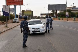 Three-week lockdown begins in Sudan- - KHARTOUM, SUDAN - APRIL 18: Sudanese police makes inspection at check points set up in main streets, after a three-week lockdown began as part of the coronavirus (Covid-19) precautions, on April 18, 2020 in Khartoum, Sudan.