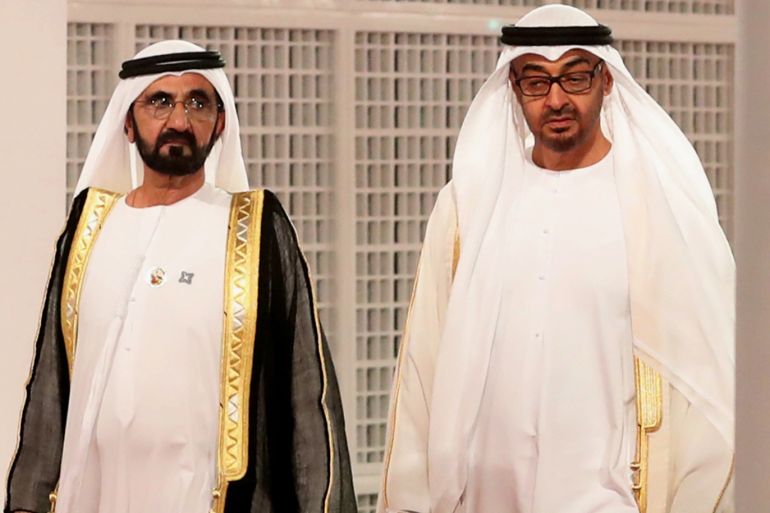 Ruler of Dubai Sheikh Mohammed bin Rashid al-Maktoum (L) and Abu Dhabi Crown Prince Mohammed bin Zayed Al-Nahyan wait for guests at the entrance of the Louvre Abu Dhabi Museum on November 8, 2017 during its inauguration on Saadiyat island in the Emirati capital. - More than a decade in the making, the Louvre Abu Dhabi is opening its doors bringing the famed name to the Arab world for the first time. (Photo by KARIM SAHIB / AFP)