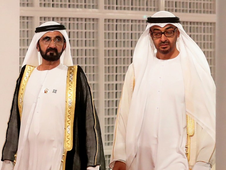 Ruler of Dubai Sheikh Mohammed bin Rashid al-Maktoum (L) and Abu Dhabi Crown Prince Mohammed bin Zayed Al-Nahyan wait for guests at the entrance of the Louvre Abu Dhabi Museum on November 8, 2017 during its inauguration on Saadiyat island in the Emirati capital. - More than a decade in the making, the Louvre Abu Dhabi is opening its doors bringing the famed name to the Arab world for the first time. (Photo by KARIM SAHIB / AFP)