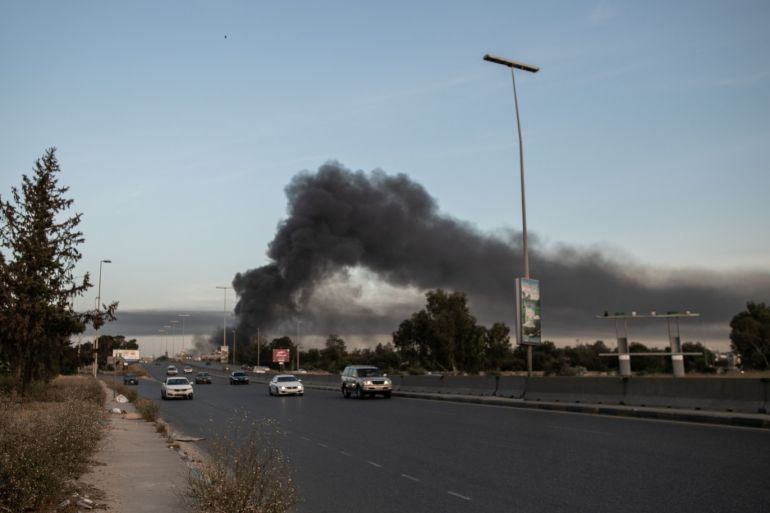 Libya: Haftar militias bomb Tripoli, 3 civilians killed- - TRIPOLI, LIBYA - MAY 6: A view of a damage site as smoke rises after an attack carried out by militias loyal to warlord Khalifa Haftar at a coastal road in Tajura region, on May 6, 2020 in Tripoli, Libya. At least three civilians were killed and 19 civilians, including children, were wounded in the attack.