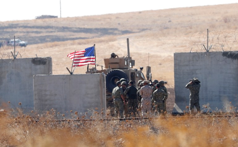 Turkish and U.S. troops meet on the Turkish-Syrian border for a joint U.S.-Turkey patrol in northern Syria, as it is pictured from near the Turkish town of Akcakale (رويترز)