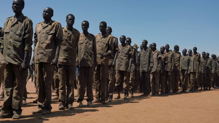South Sudan soldiers stand in a fomation as they gather at the training site for the joint force to protect VIPs in Gorom outside Juba