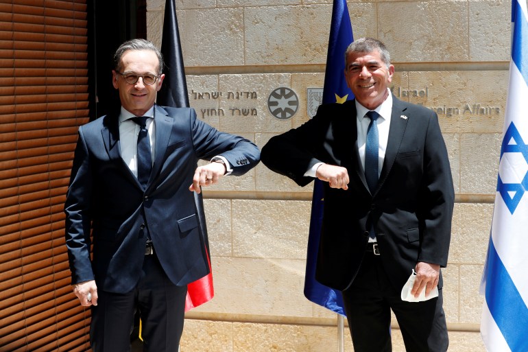 Israeli Foreign Minister Gabi Ashkenazi and his German counterpart Heiko Maas greet each other during their meeting in Jerusalem