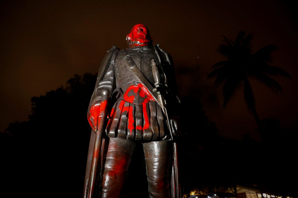A vandalized statue of Christopher Columbus at the Bayside Marketplace in Downtown Miami
