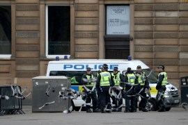 Police officers are seen at George Square in Glasgow