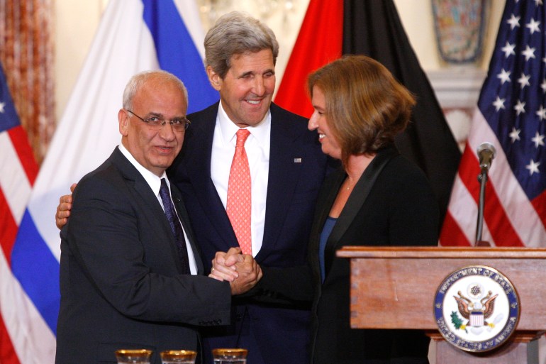 Chief Palestinian negotiator Erekat, U.S. Secretary of State Kerry and Israel's Justice Minister Livni shake hands at a news conference at the end of talks at the State Department in Washington
