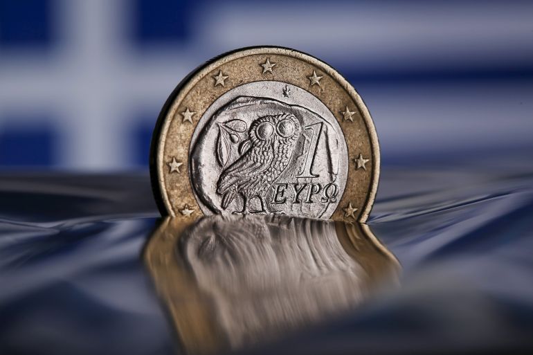 A one Euro coin with a Greek owl is seen in this picture illustration taken in Rome