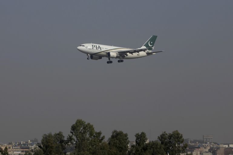 A Pakistan International Airlines (PIA) passenger plane arrives at the Benazir International airport in Islamabad, Pakistan