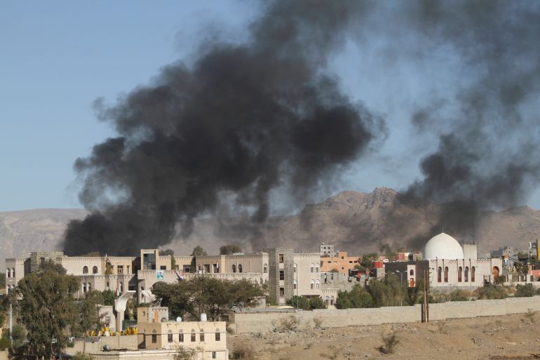 Smoke rises after an airstrike on the military site in Sanaa