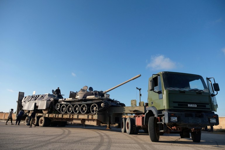 Libyan National Army (LNA) members, commanded by Khalifa Haftar, equip the military vehicles to get out of Benghazi to reinforce the troops advancing to Tripoli, in Benghazi