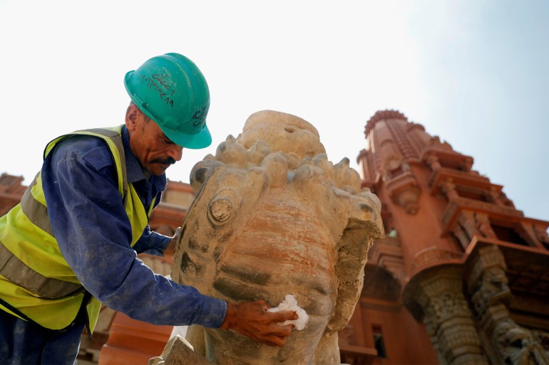 An Egyptian worker carries out the renovation work of the Baron Empain Palace, "Qasr el Baron" or The Hindu Palace, built in the 20th century by the Belgian industrialist Edouard Louis Joseph, also known as Baron Empain, in the Cairo's suburb Heliopolis, Egypt August 18, 2019. Picture taken August 18, 2019. REUTERS/Amr Abdallah Dalsh