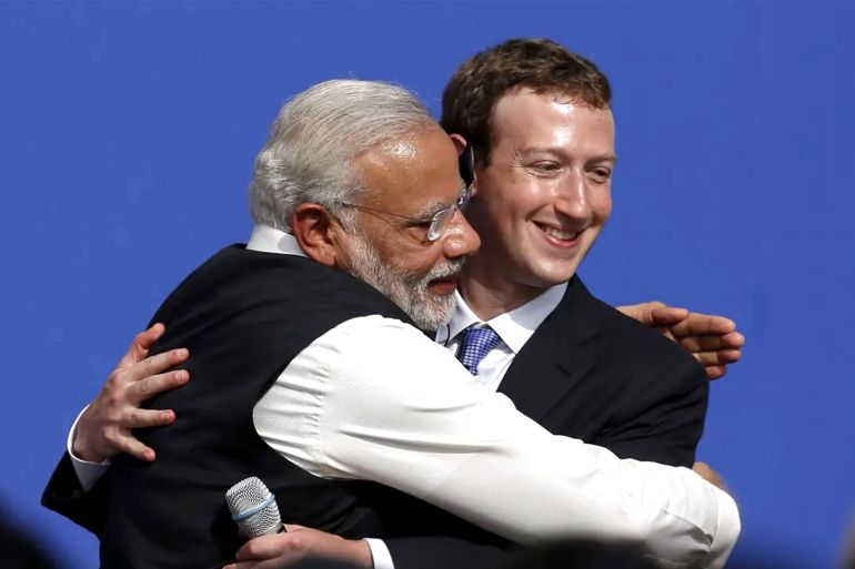 Narendra Modi, India's prime minister, left, and Mark Zuckerberg, chief executive officer of Facebook Inc., embrace at the conclusion of a town hall meeting at Facebook headquarters in Menlo Park, California, U.S., on Sunday, Sept. 27, 2015. Prime Minister Modi plans on connecting 600,000 villages across India using fiber optic cable as part of his 'dream' to expand the world's largest democracy's economy to $20 trillion. Photographer: David Paul Morris/Bloomberg via Getty Images