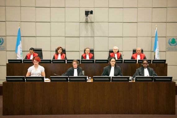 Judges of the U.N. Special Tribunal for Lebanon (STL) (back row, L to R) Janet Nosworthy, Micheline Braidi, Robert Roth, David Re and Walid Akoum attend the opening of the public hearing at the court in Leidschendam, near The Hague June 13, 2012. The Lebanon tribunal held the hearing to decide whether it has jurisdiction to try those responsible for the assassination of Lebanese prime minister in 2005. The defence teams of the four suspects challenged the legality of the tribunal. REUTERS/Robert Vos/Pool (NETHERLANDS - Tags: POLITICS CRIME LAW)