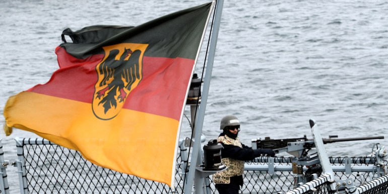 A soldier of the German Navy guards a frigate as he takes part in the exercise "Northern Coast", in the Baltic Sea near Rostock