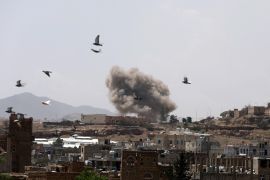 Dust rises from the site of a Saudi-led air strike in Sanaa