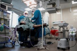 Medical specialists treat patients infected with the coronavirus disease in a hospital in Moscow