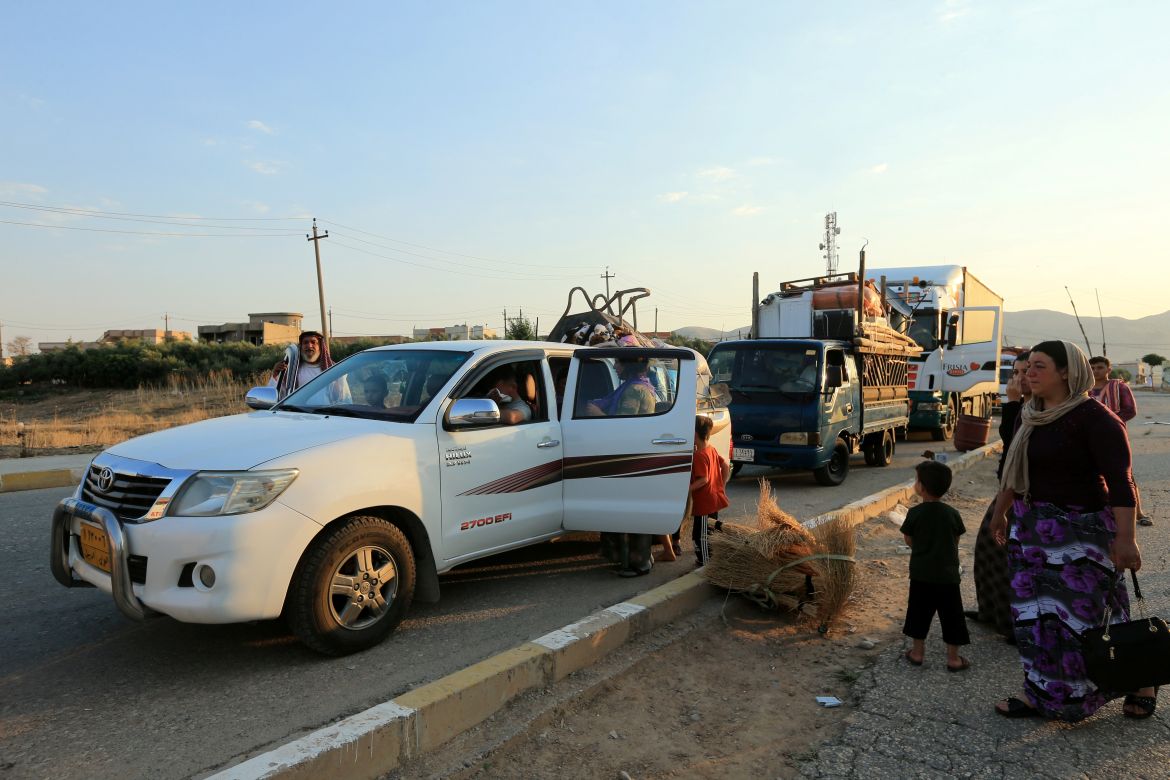 Yazidi displaced family al-Hamo leave their home in Sharya town and head back to Sinjar