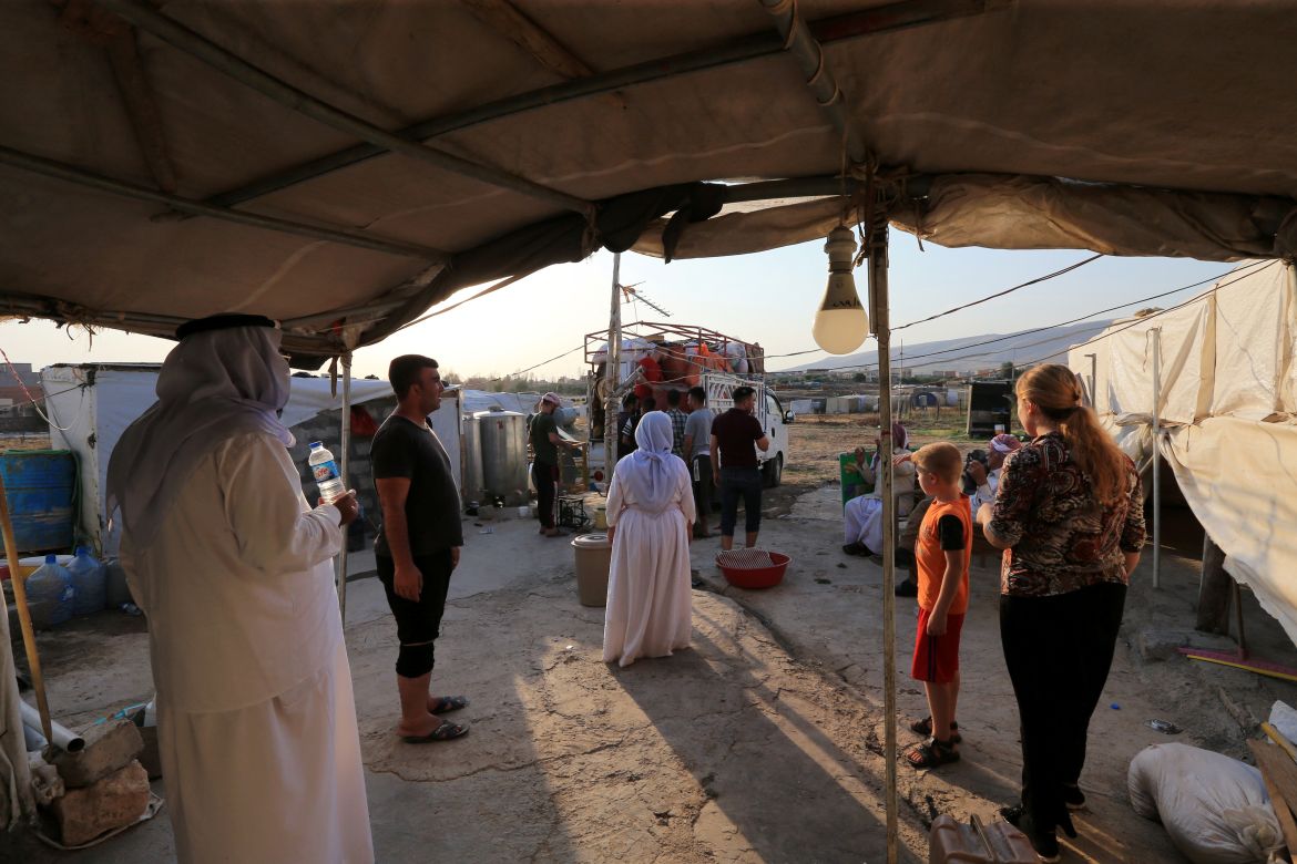 Yazidi displaced family al-Hamo leave their home in Sharya town and head back to Sinjar