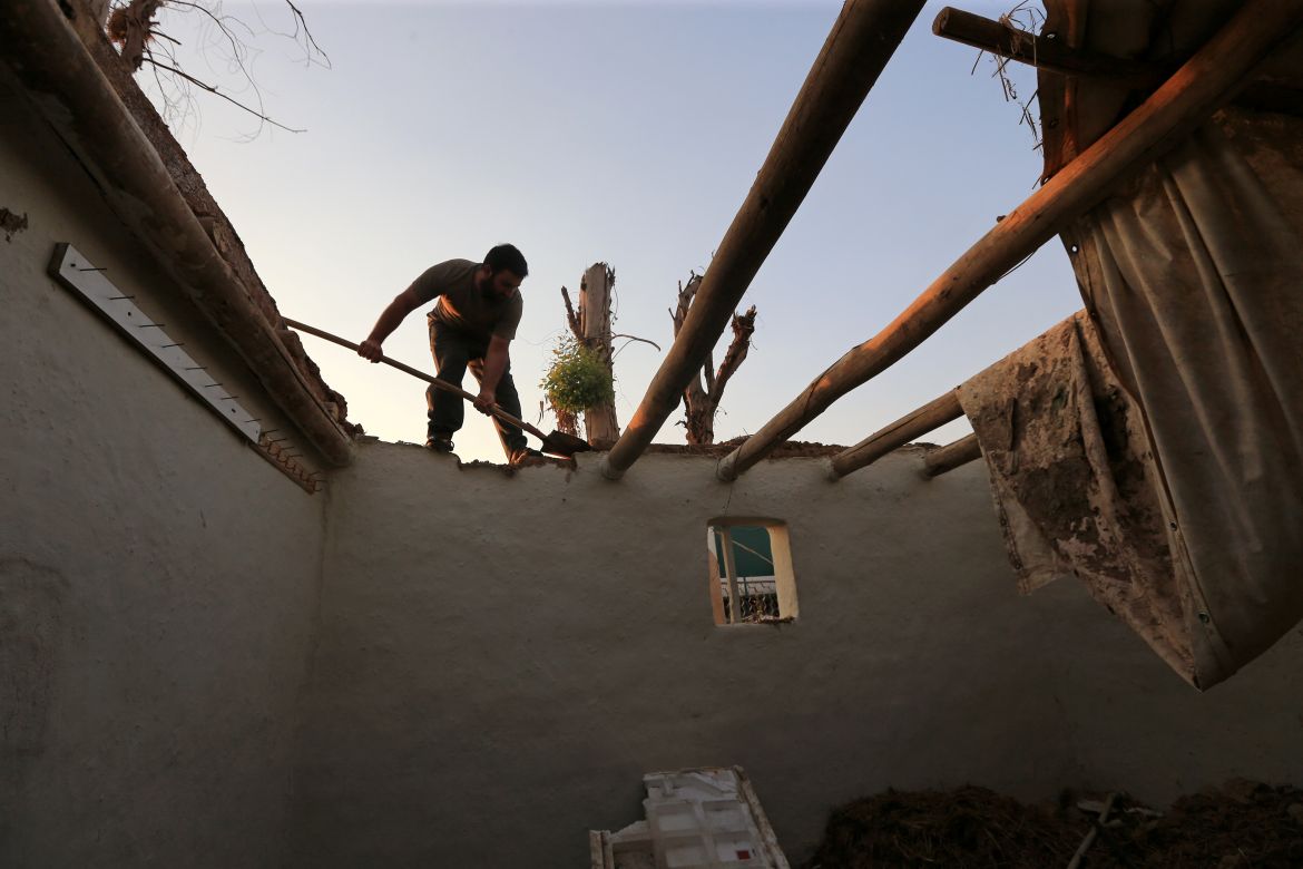 Yazidi displaced family al-Hamo leave their home in Sharya town and head back to Sinjar