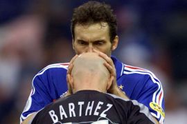 France's Laurent Blanc kisses goalkeeper Fabien Barthez on the head before the European Championship..