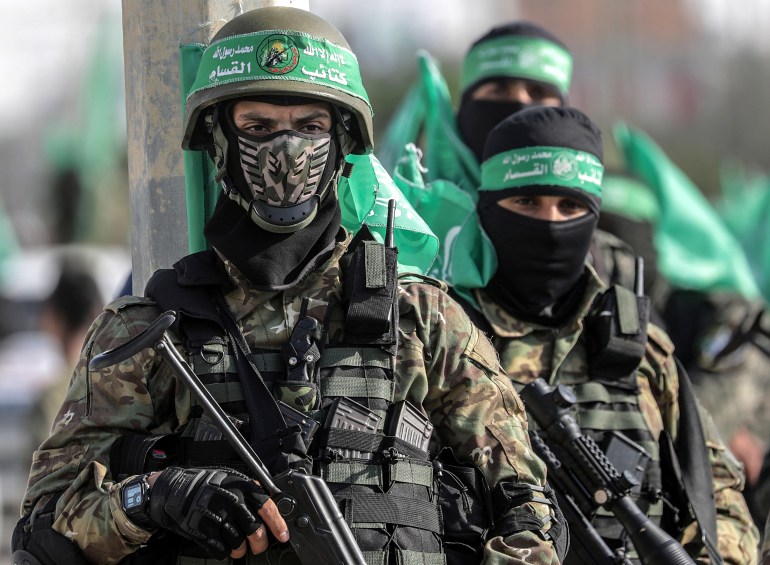 epa07988980 Fighters of Ezz al-Din al-Qassam brigades, the military wing of Hamas movement march during a military parade in the east Khan Younis town, southern Gaza Strip, 11 November 2019. EPA-EFE/MOHAMMED SABER
