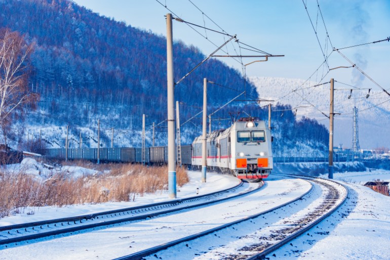 Freight train moves along Baikal lake. Trans Siberian railway. Russia.; Shutterstock ID 1063038452; Department: -